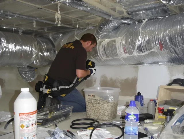 Marblehead Air Duct Cleaning specialist performing professional mold removal from air ducts in Marblehead