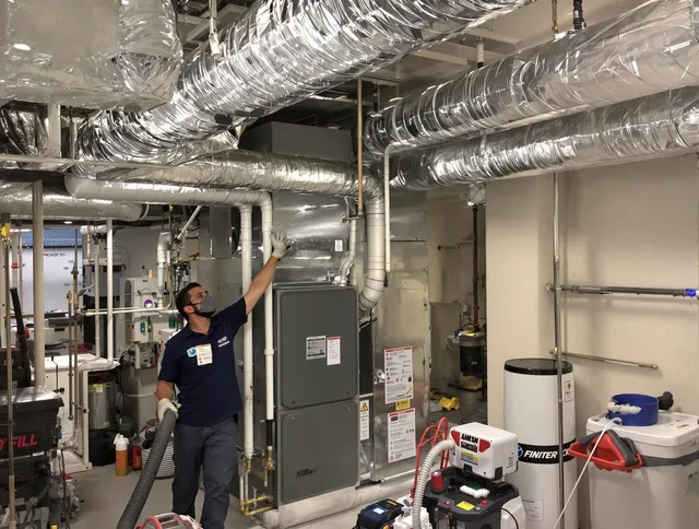 Marblehead Air Duct Cleaning specialist performing thorough furnace duct cleaning in a Marblehead residence