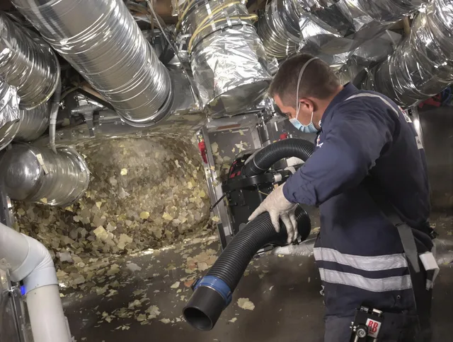 Marblehead Air Duct Cleaning specialist operating negative pressure cleaning equipment for thorough duct maintenance in Marblehead