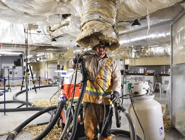 Professional vacuum insulation removal by Marblehead Air Duct Cleaning expert in Marblehead
